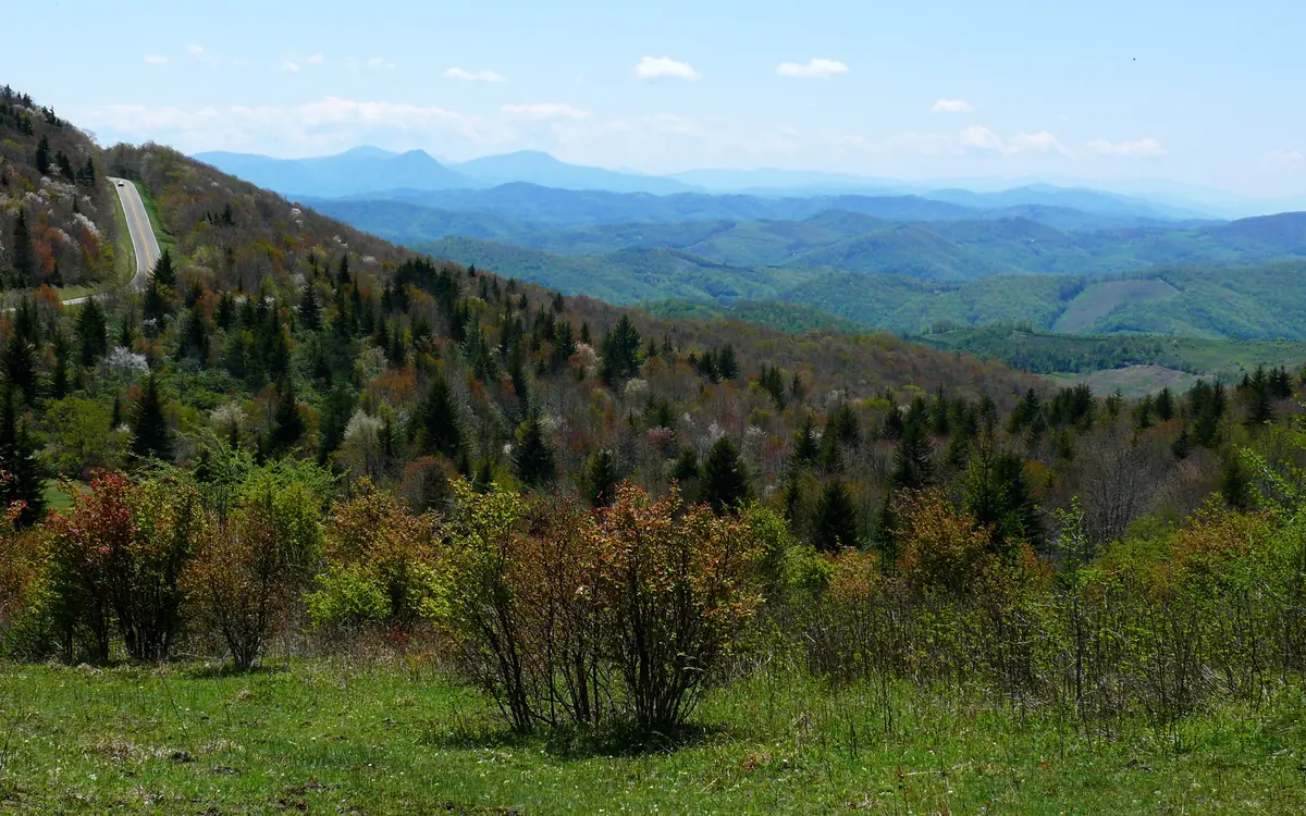 Open grassy balds and rock outcrops on Wilburn Ridge at Grayson Highlands State Park under a wide sky